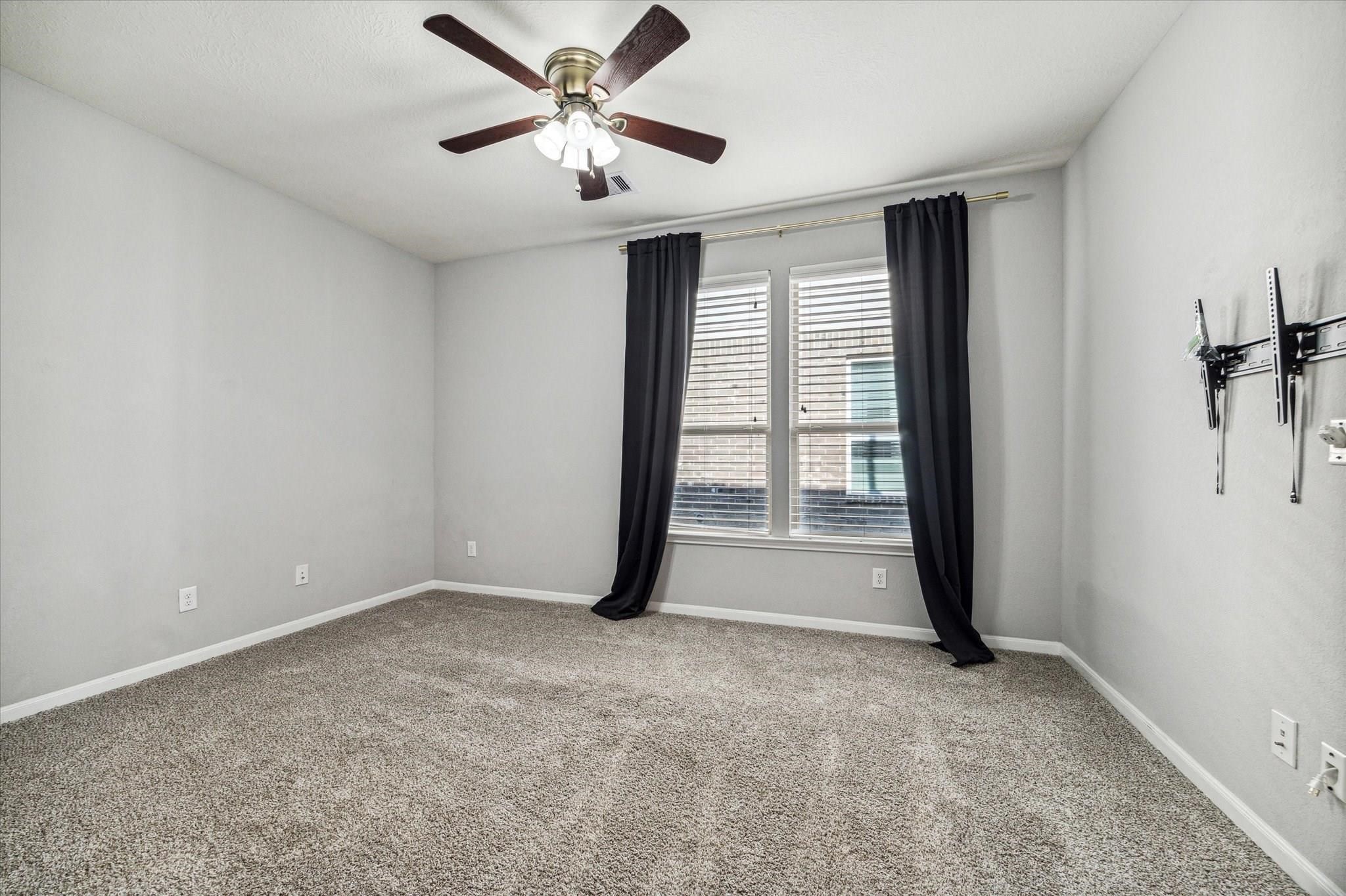 14019 Harmony Ridge Trail Pearland, TX 77584 - Photo 8 of 10 a view of an empty room with a window