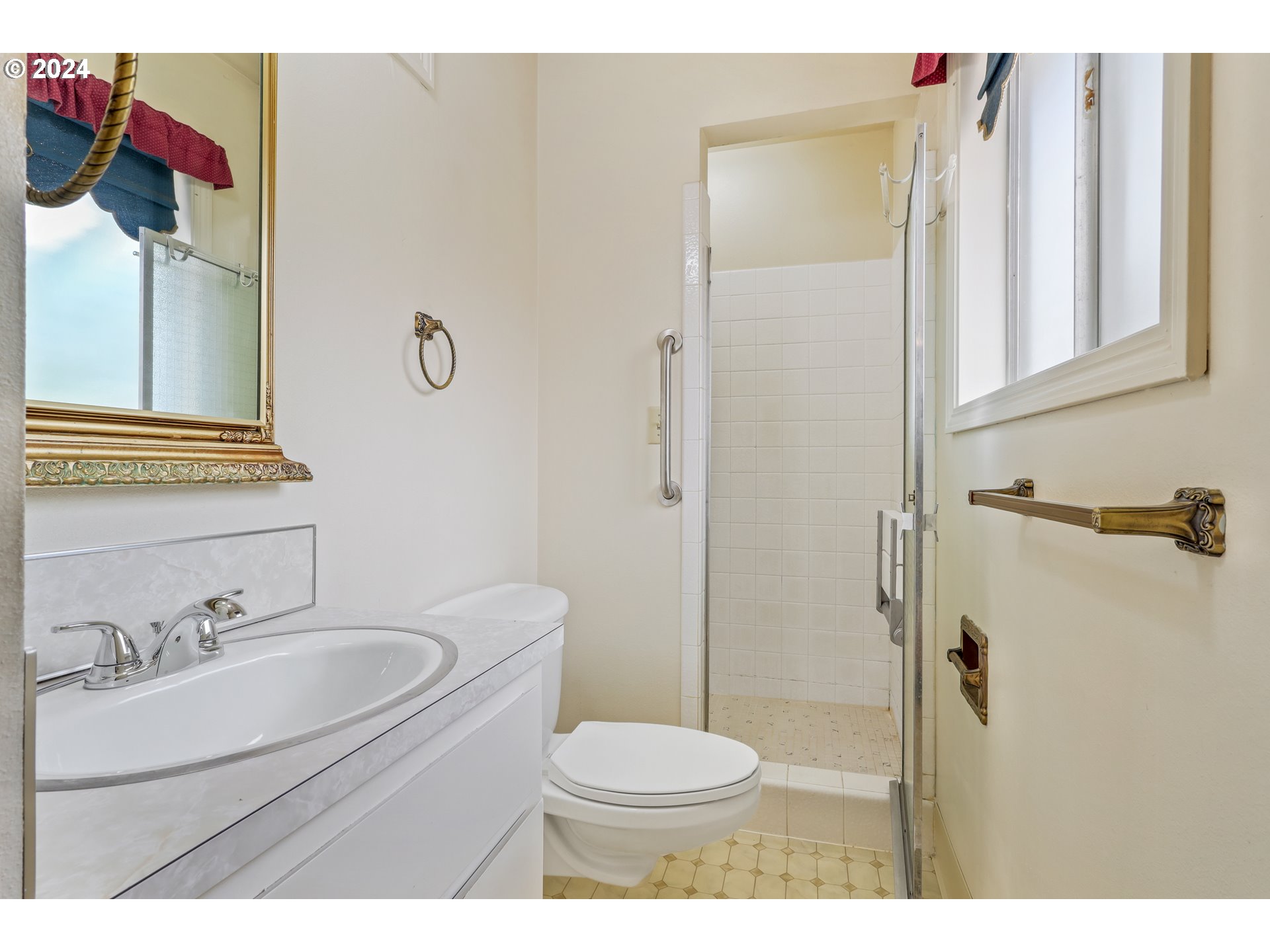 7130 Southwest Locust Street Portland, OR 97223 - Photo 8 of 28 a bathroom with a sink toilet and shower