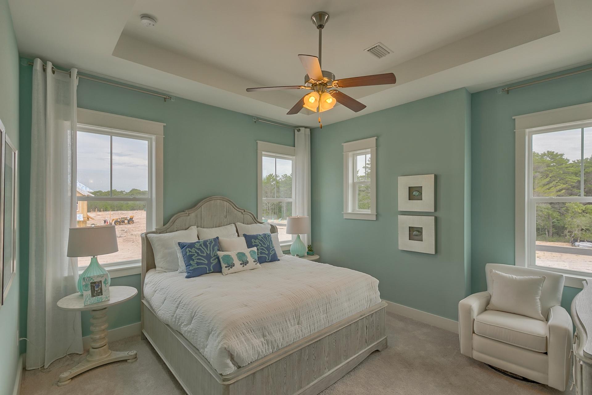 34 Pine Lands Loop West Inlet Beach, FL 32461 - Photo 8 of 40 a bedroom with a large bed and a couch
