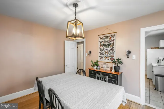a dining room with a table and chairs