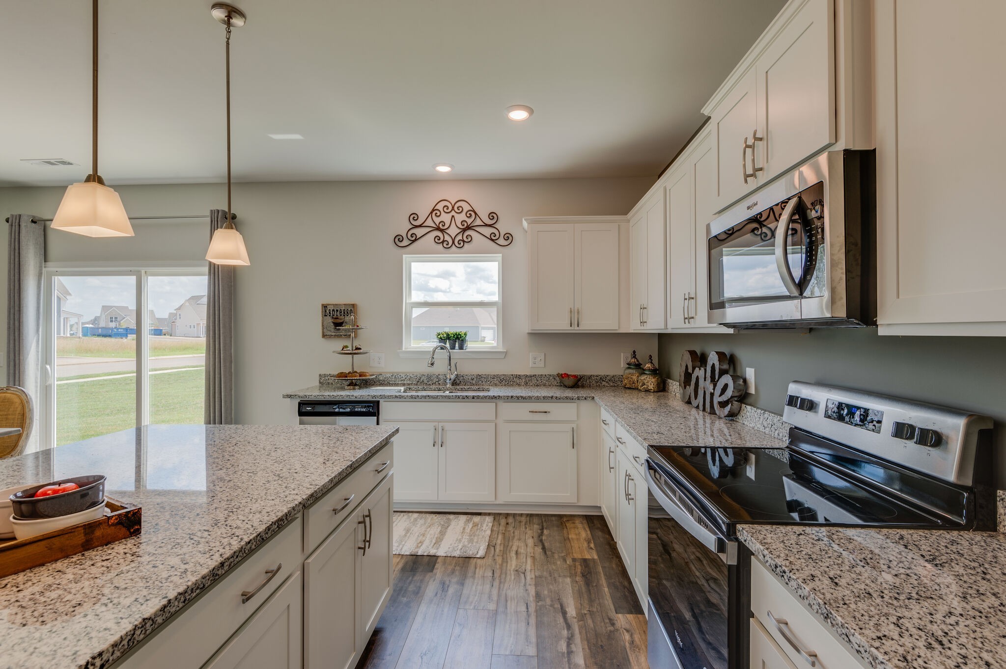 611 Castle Road Mount Juliet, TN 37122 - Photo 11 of 30 a kitchen with stainless steel appliances granite countertop a stove a sink and a wooden cabinets