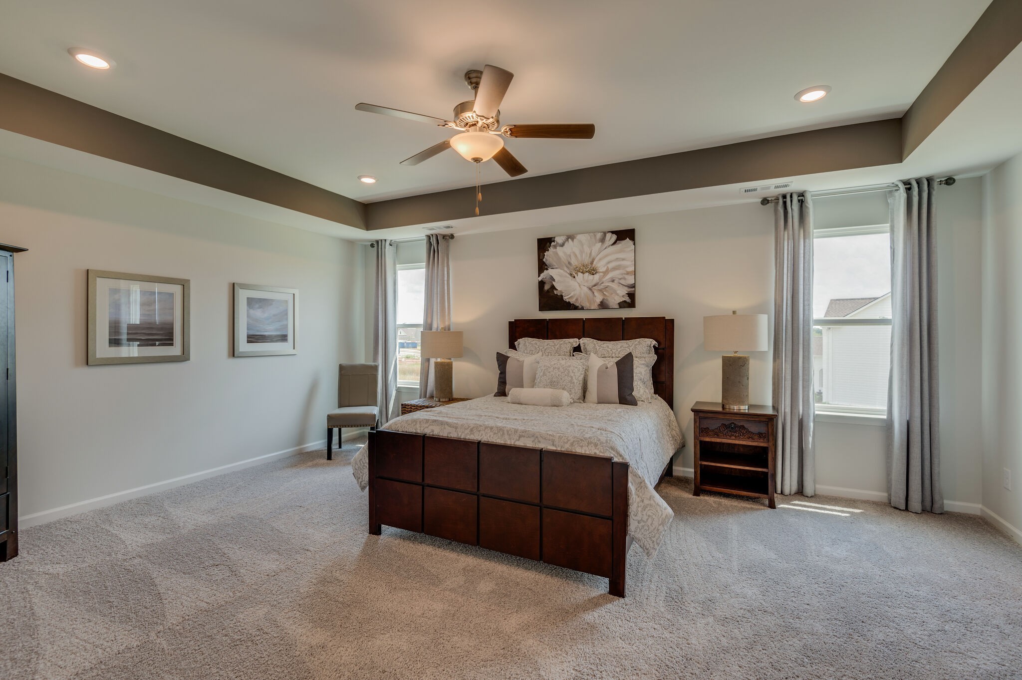 611 Castle Road Mount Juliet, TN 37122 - Photo 18 of 30 a bedroom with a bed and a chandelier