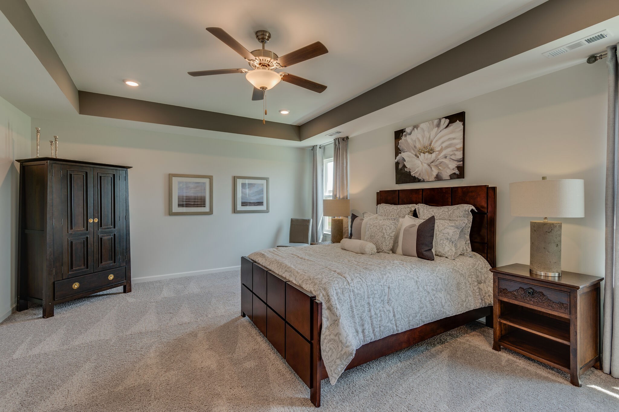 611 Castle Road Mount Juliet, TN 37122 - Photo 19 of 30 a bedroom with a bed and a chandelier