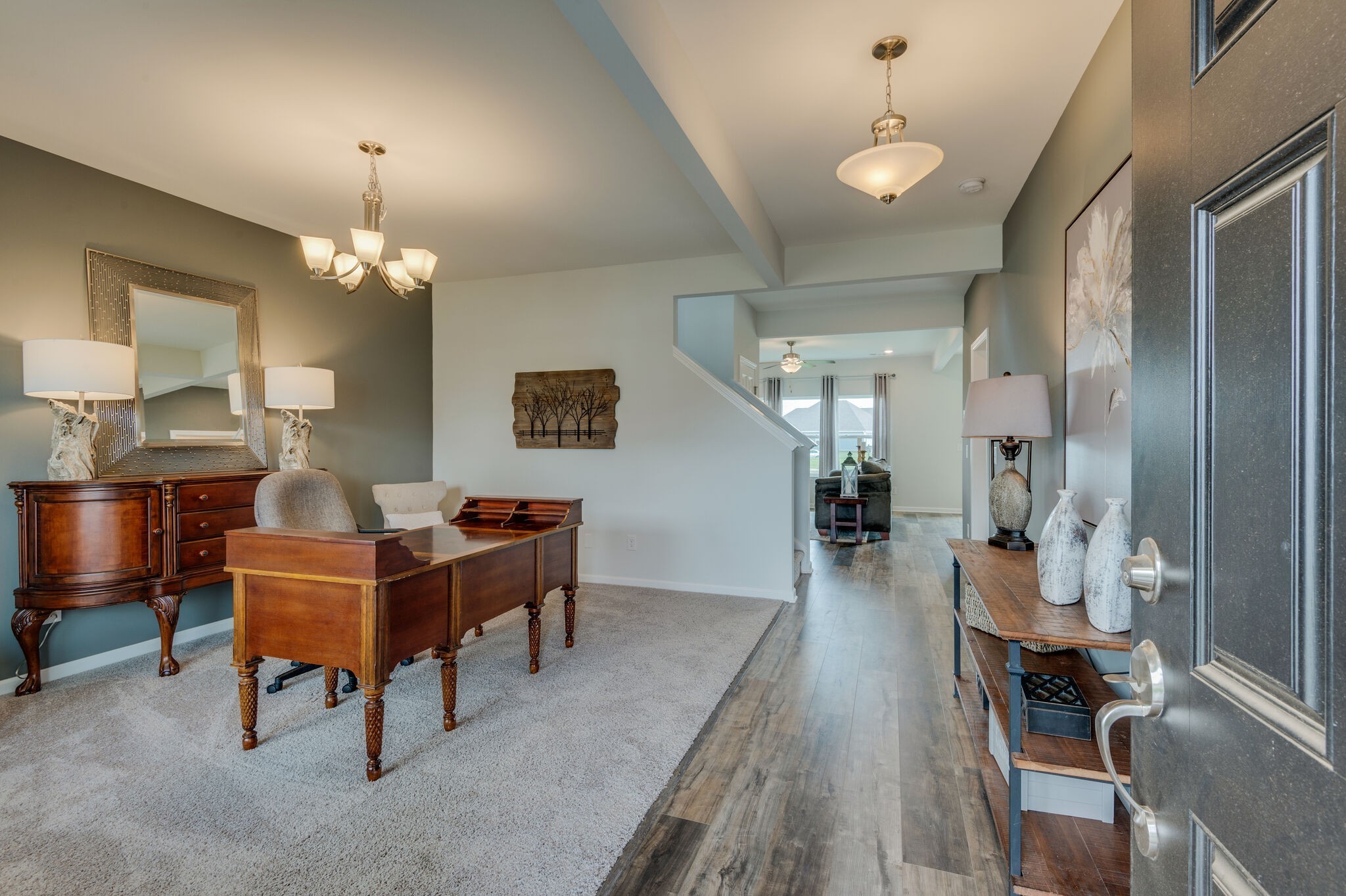 611 Castle Road Mount Juliet, TN 37122 - Photo 3 of 30 a living room with furniture and a chandelier