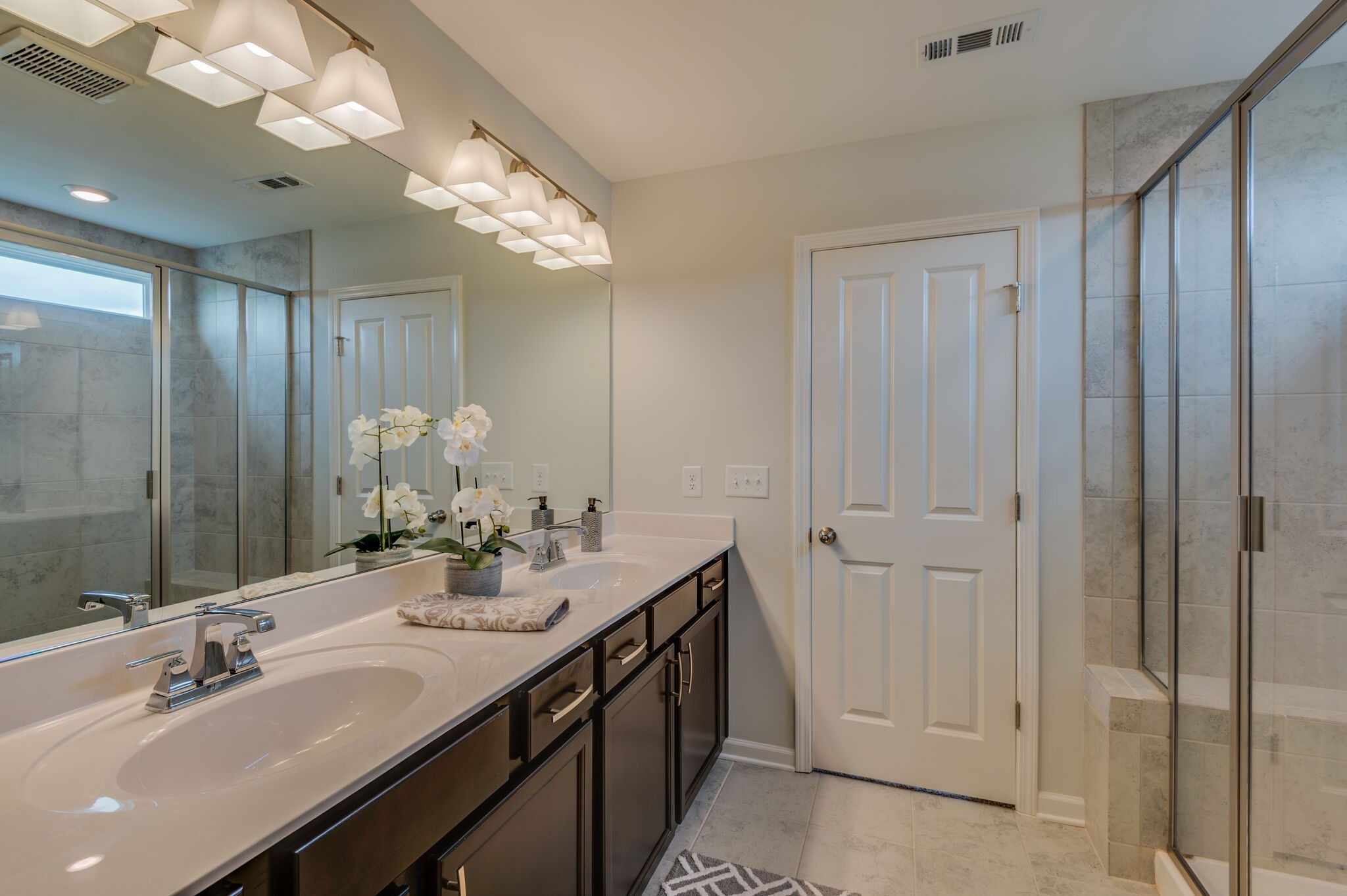 611 Castle Road Mount Juliet, TN 37122 - Photo 21 of 30 a bathroom with a double vanity sink and a mirror