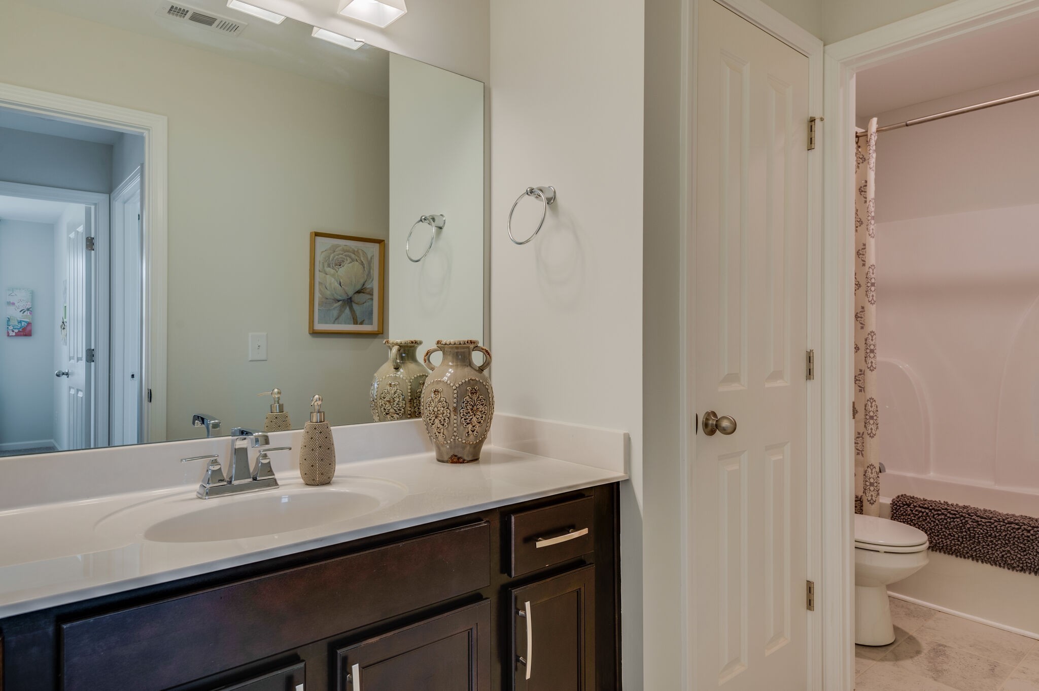 611 Castle Road Mount Juliet, TN 37122 - Photo 26 of 30 a bathroom with a granite countertop sink toilet and shower