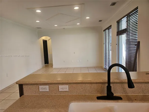 a view of an empty room with a mirror