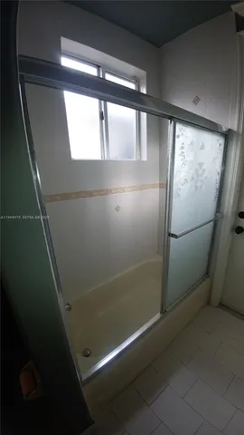 a view of a room that has a window in it