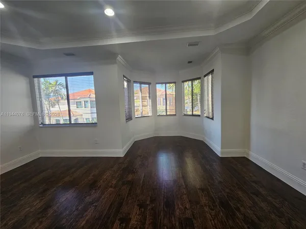 a white toilet sitting next to a small bathroom