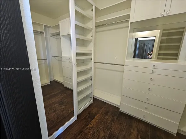 a bathroom with a sink and a large mirror