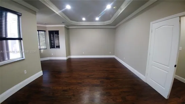 a view of room with window and hardwood floor