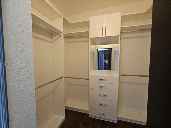 a white toilet sitting next to a bath tub