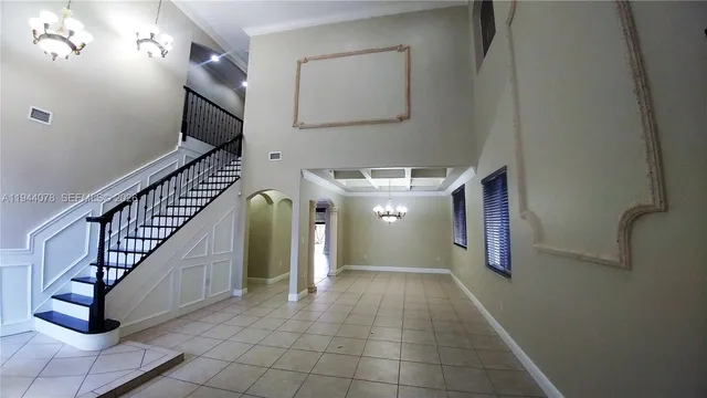 a view of entryway and hall with a front door