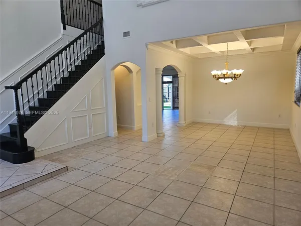 a kitchen with stainless steel appliances a sink a stove top oven a counter space and cabinets