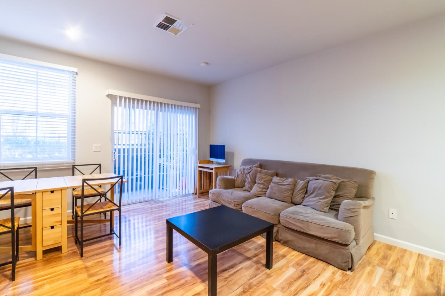 88 North Jackson Avenue, Unit 127 San Jose, CA 95116 - Photo 3 of 10 a living room with furniture and a wooden floor