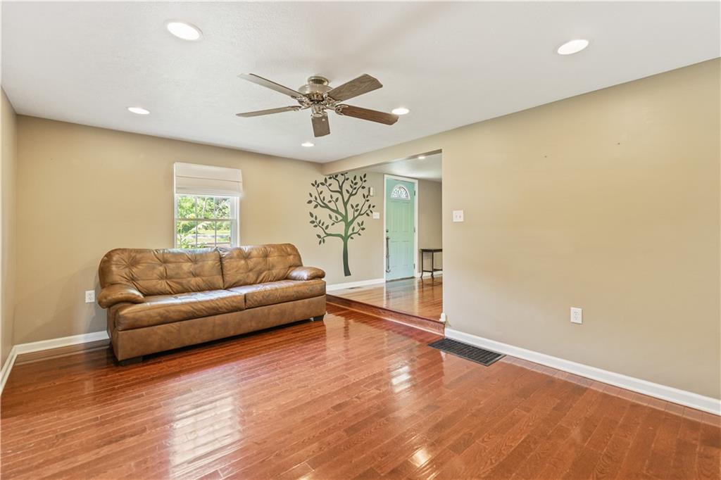 815 Arbor Ln Mount Mount Pleasant, PA 15666 - Photo 11 of 25 a living room with furniture and a large window