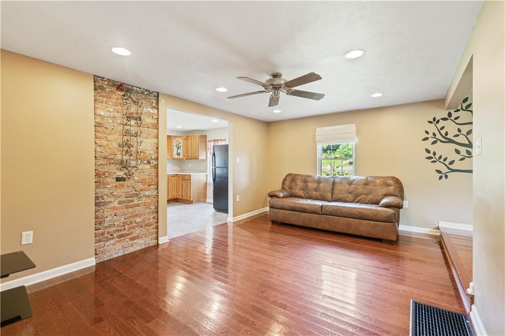 815 Arbor Ln Mount Mount Pleasant, PA 15666 - Photo 12 of 25 a living room with furniture and wooden floor