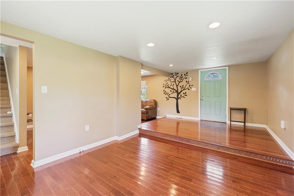 815 Arbor Ln Mount Mount Pleasant, PA 15666 - Photo 14 of 25 a view of empty room with wooden floor