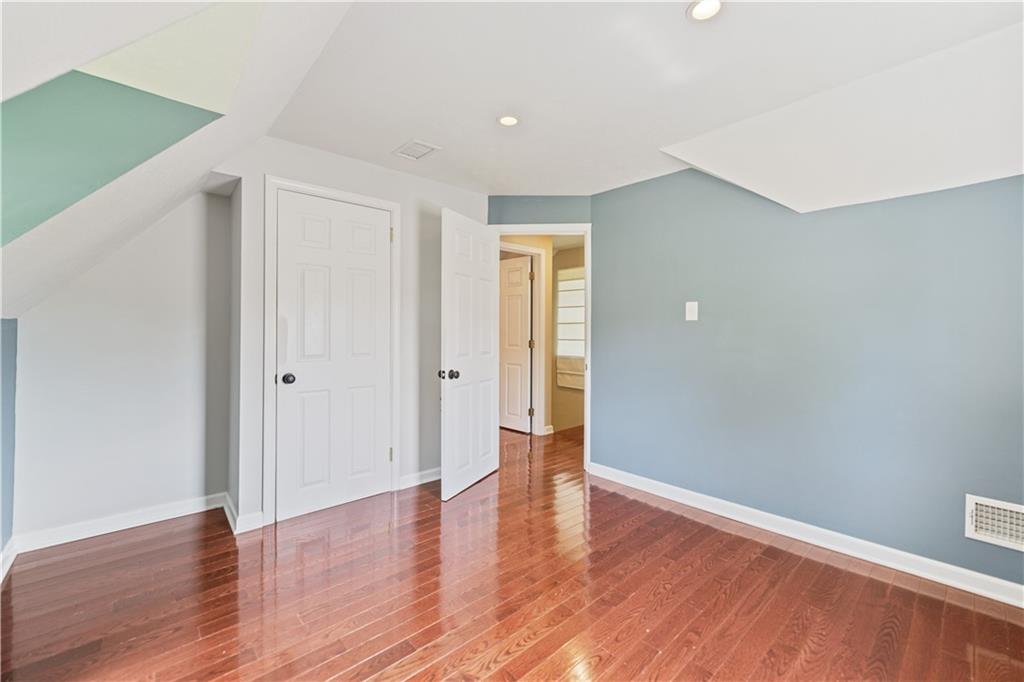 815 Arbor Ln Mount Mount Pleasant, PA 15666 - Photo 20 of 25 a view of an empty room with wooden floor