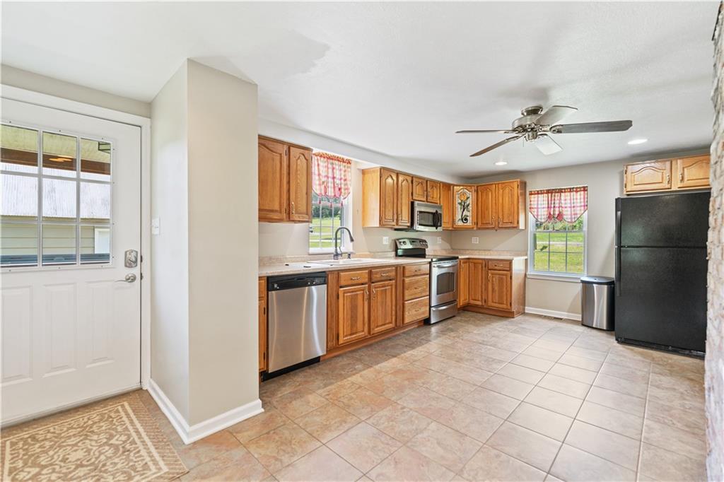 815 Arbor Ln Mount Mount Pleasant, PA 15666 - Photo 6 of 25 a kitchen with a refrigerator and a sink