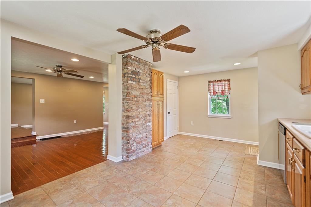 815 Arbor Ln Mount Mount Pleasant, PA 15666 - Photo 8 of 25 wooden floor in an empty room with a window