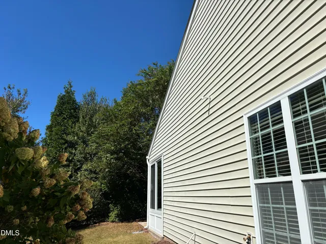 a view of walk in closet with clothes