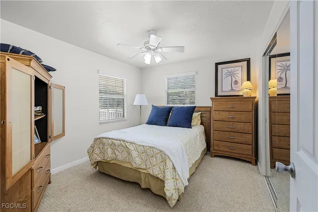 a bedroom with a bed dresser and a window