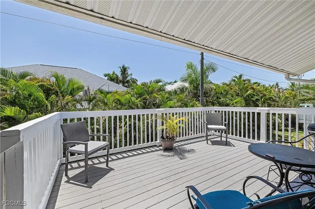 a view of a chair and table on the wooden floor