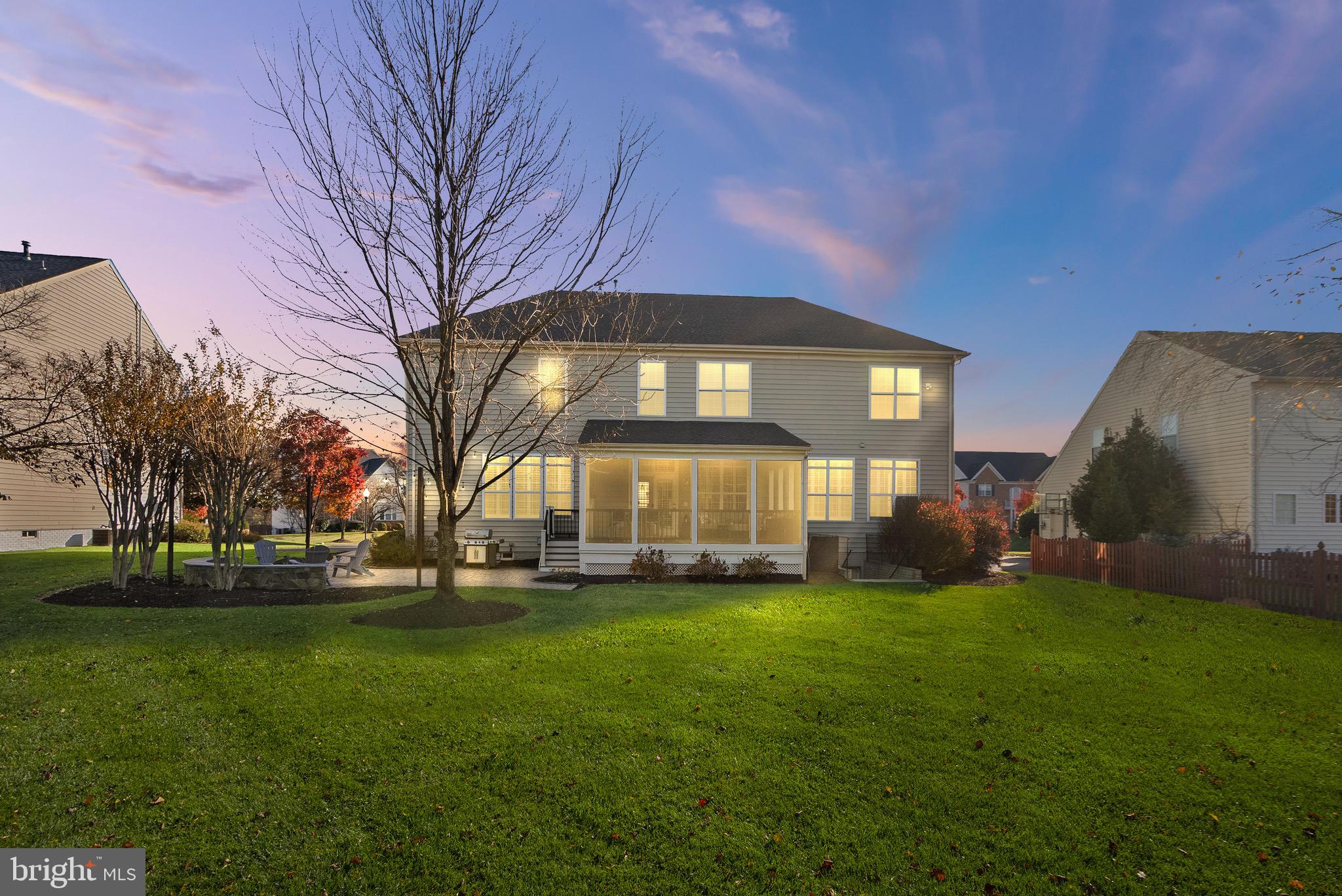 22473 Terra Rosa Place Ashburn, VA 20148 - Photo 10 of 17 a large brick building with a big yard and large trees