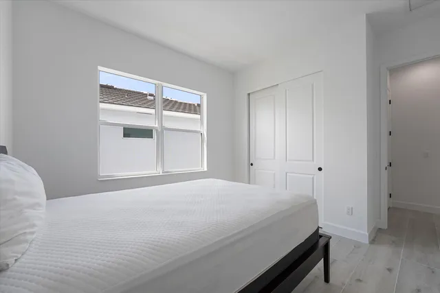 an aerial view of a residential houses with outdoor space and swimming pool