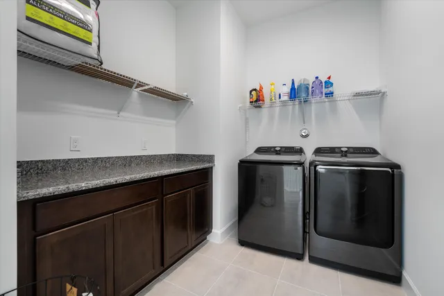 an aerial view of residential houses with outdoor space and swimming pool