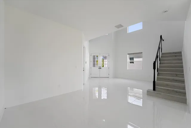 a kitchen with kitchen island cabinets and refrigerator