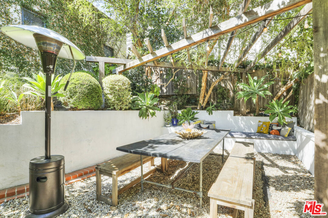 3003 Fall Avenue Los Angeles, CA 90026 - Photo 13 of 45 a view of backyard with table and chairs and potted plants