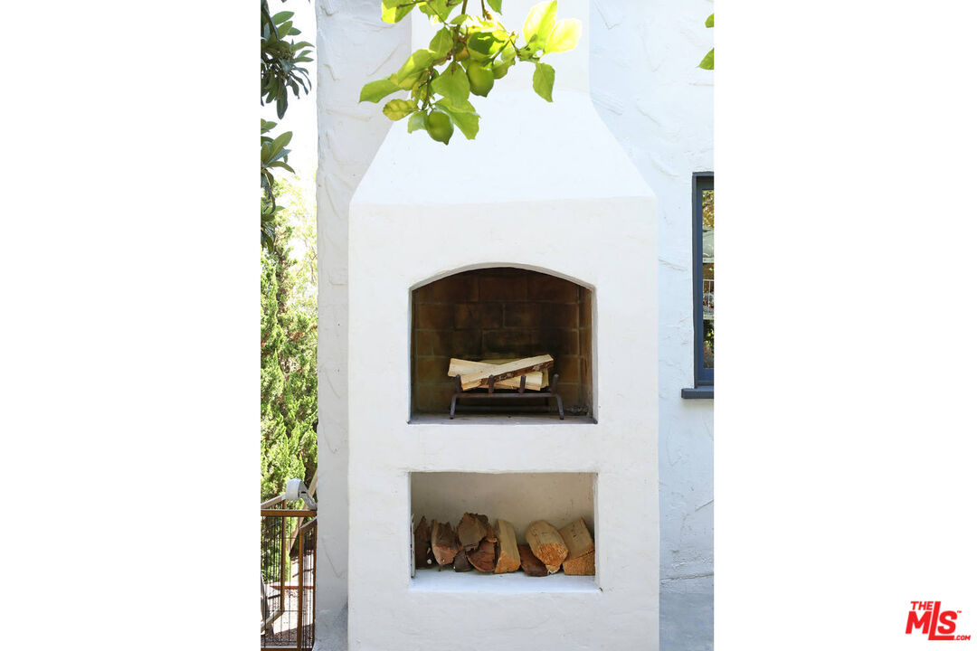 3003 Fall Avenue Los Angeles, CA 90026 - Photo 16 of 45 a living room with a chair and a potted plant