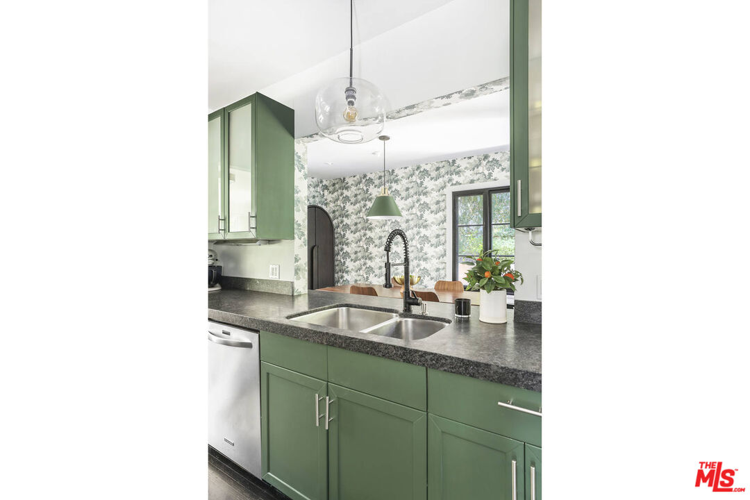 3003 Fall Avenue Los Angeles, CA 90026 - Photo 18 of 45 a kitchen with a sink and a mirror
