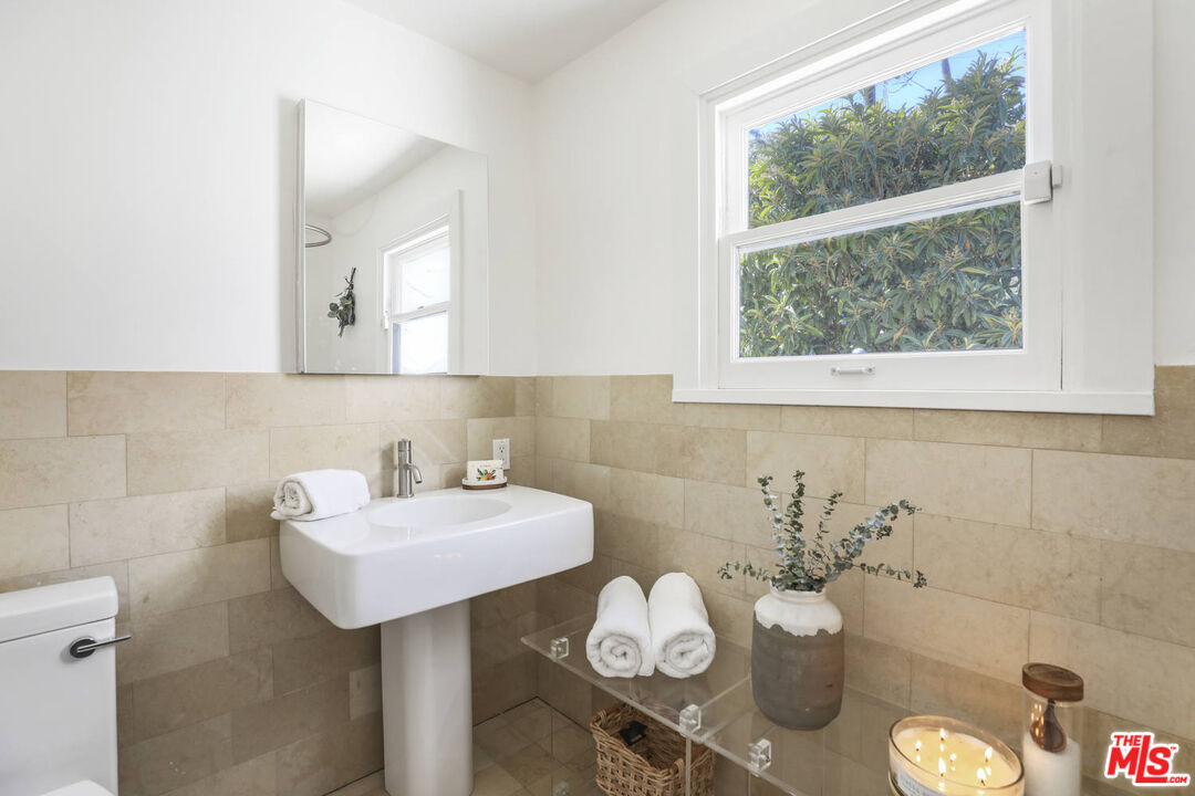 3003 Fall Avenue Los Angeles, CA 90026 - Photo 30 of 45 a bathroom with a sink and a mirror