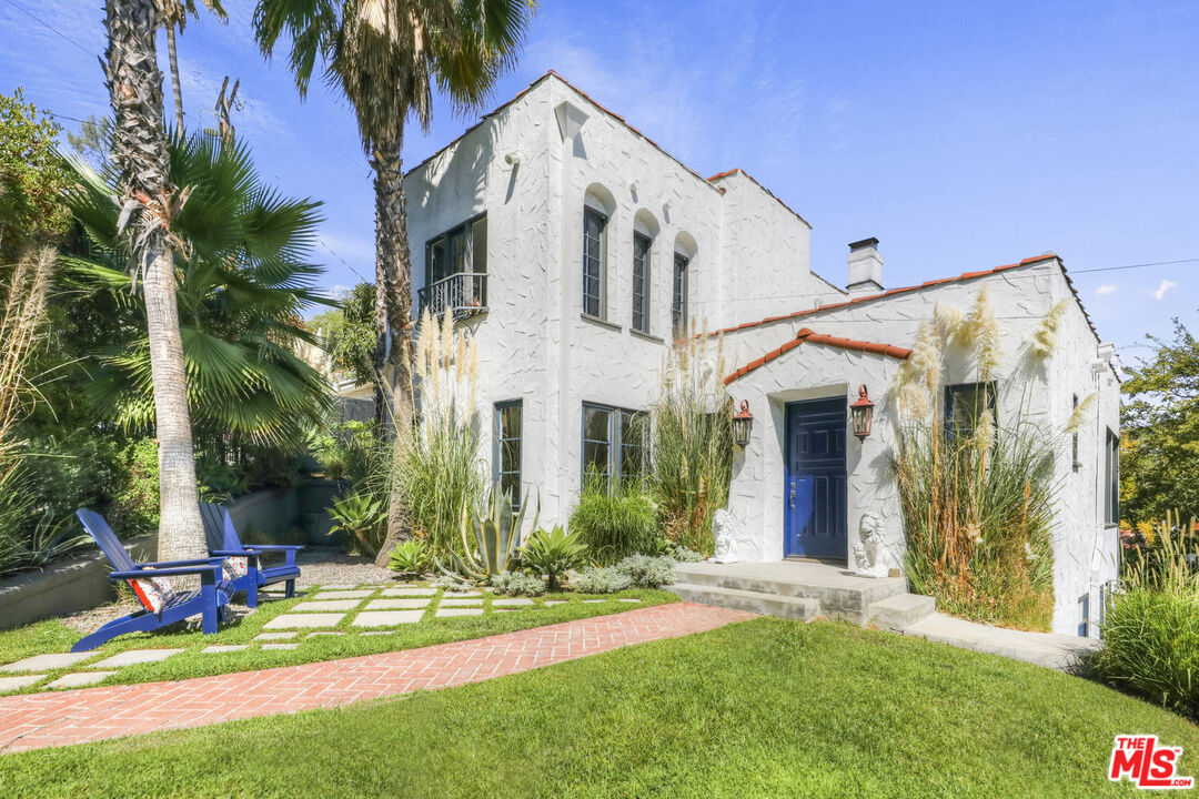 3003 Fall Avenue Los Angeles, CA 90026 - Photo 4 of 45 a view of a white house with a yard and plants