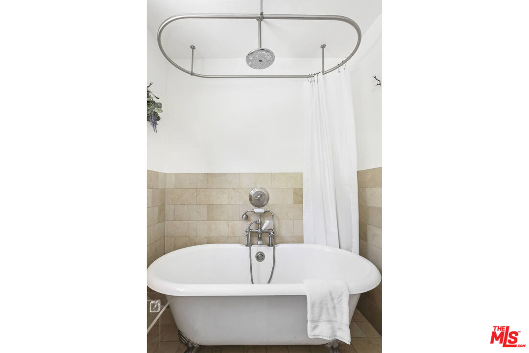 3003 Fall Avenue Los Angeles, CA 90026 - Photo 31 of 45 a bathroom with a sink and mirror