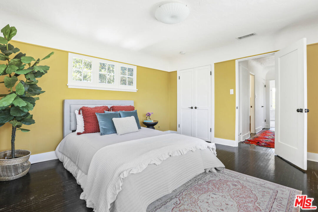 3003 Fall Avenue Los Angeles, CA 90026 - Photo 32 of 45 a bedroom with a bed and a potted plant