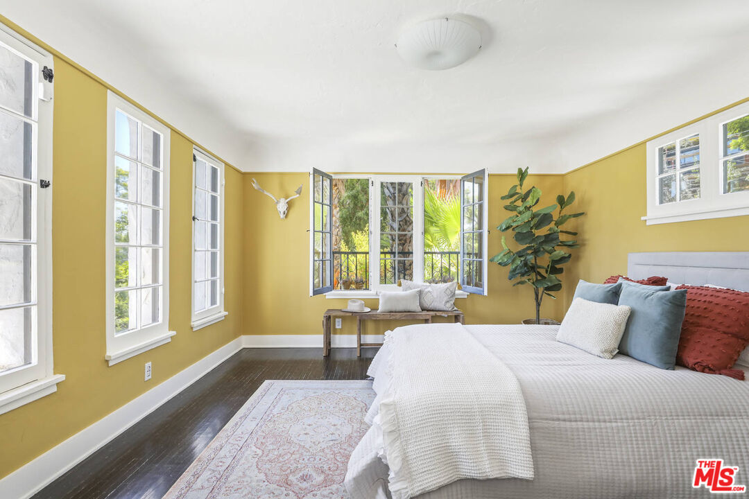 3003 Fall Avenue Los Angeles, CA 90026 - Photo 33 of 45 a bedroom with a large bed and a large window