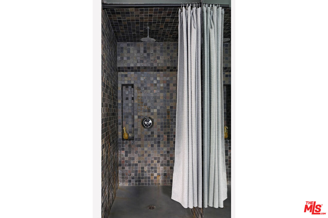 3003 Fall Avenue Los Angeles, CA 90026 - Photo 40 of 45 a close view of a bathroom with a shower curtain