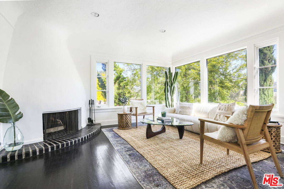 3003 Fall Avenue Los Angeles, CA 90026 - Photo 10 of 45 a living room with fireplace furniture and a large window