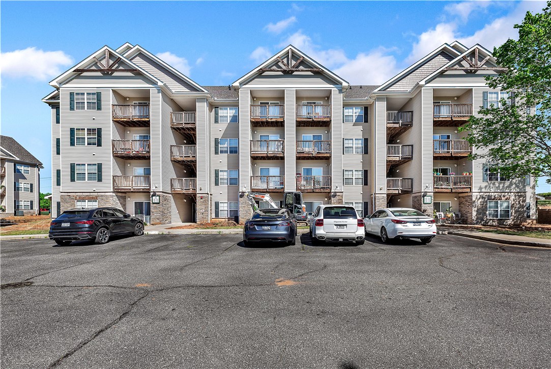 This multi-level residence features private balconies and classic architectural design.