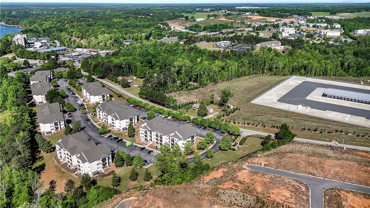 726 Lookover Drive Anderson, SC 29621 - Photo 11 of 32 An aerial view captures the expansive landscape surrounding these residences, offering serene lake views and lush greenery.