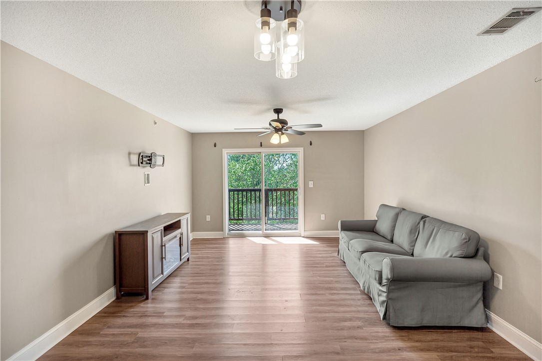 726 Lookover Drive Anderson, SC 29621 - Photo 12 of 32 This inviting living area boasts rich hardwood flooring and convenient balcony access.