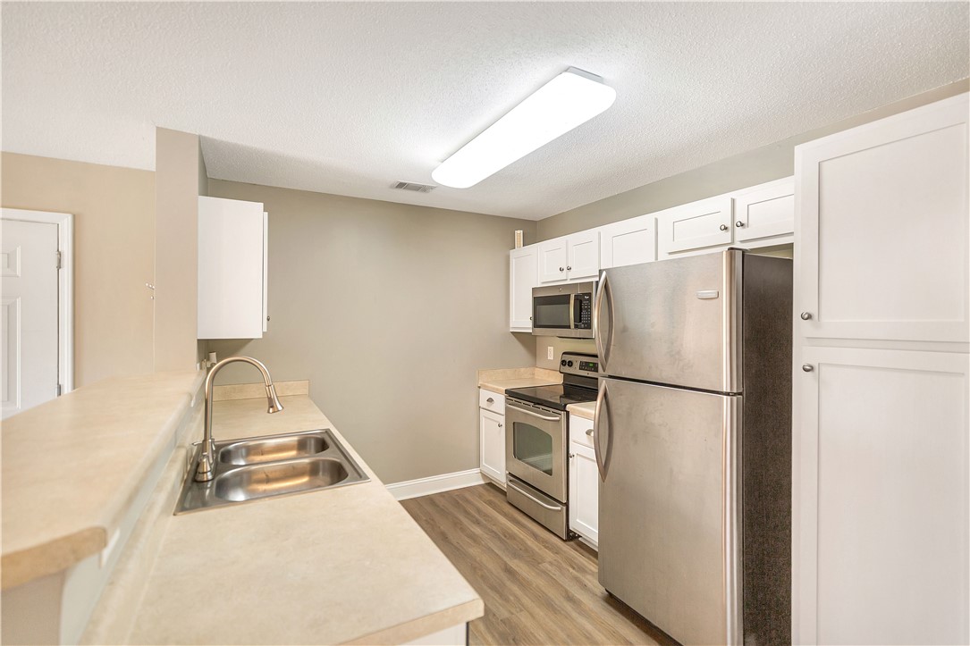 726 Lookover Drive Anderson, SC 29621 - Photo 18 of 32 This functional kitchen features stainless steel appliances and ample counter space for daily living.