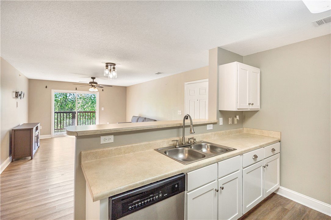 726 Lookover Drive Anderson, SC 29621 - Photo 19 of 32 This bright kitchen with a breakfast bar seamlessly connects to the airy living area.