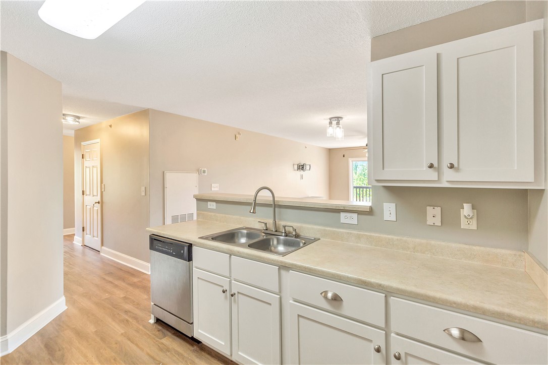 726 Lookover Drive Anderson, SC 29621 - Photo 21 of 32 This bright kitchen with a pass-through window offers modern functionality and an inviting atmosphere.