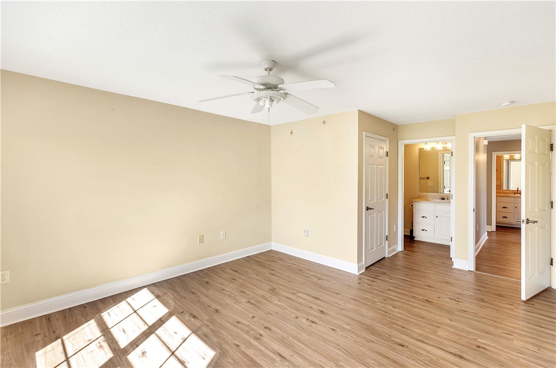 726 Lookover Drive Anderson, SC 29621 - Photo 28 of 32 This airy bedroom features natural light and direct access to a well-appointed bathroom.