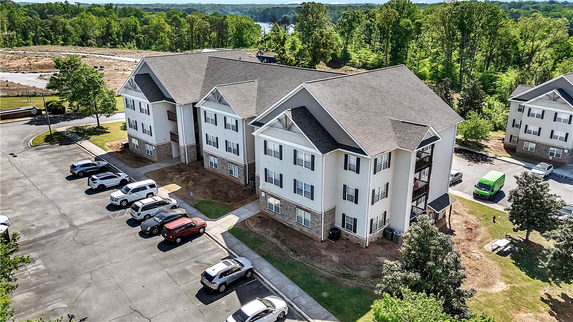 726 Lookover Drive Anderson, SC 29621 - Photo 3 of 32 This multifamily dwelling offers comfortable living with ample parking and serene views of the surrounding natural landscape.